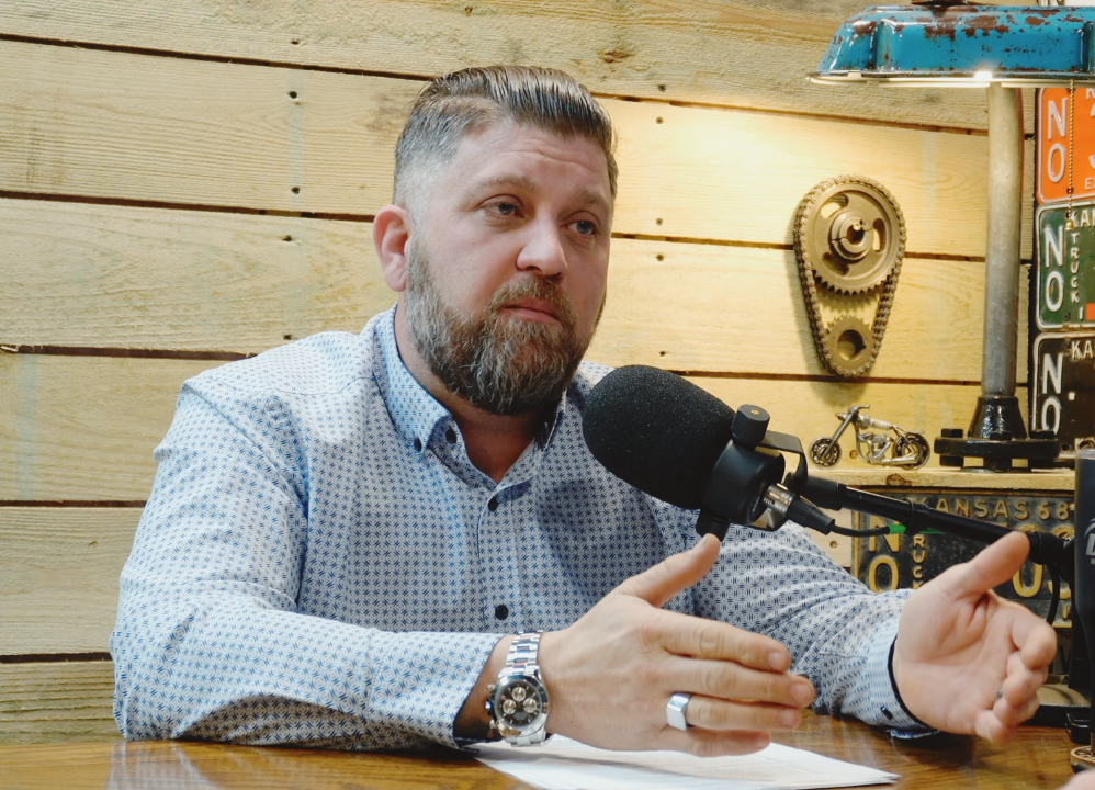Brent recording in the Grindwise podcast studio built by Blue Couch Studio